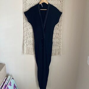 D. Exterior, Made In Italy. Black jumpsuit, with silver beaded trim, siz…
